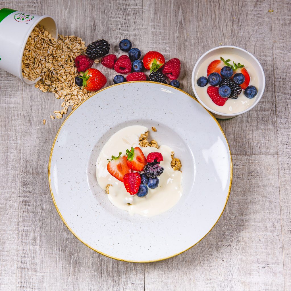 A fresh, low calorie Food Fit meal containing spring berry overnight oats in a white bowl.