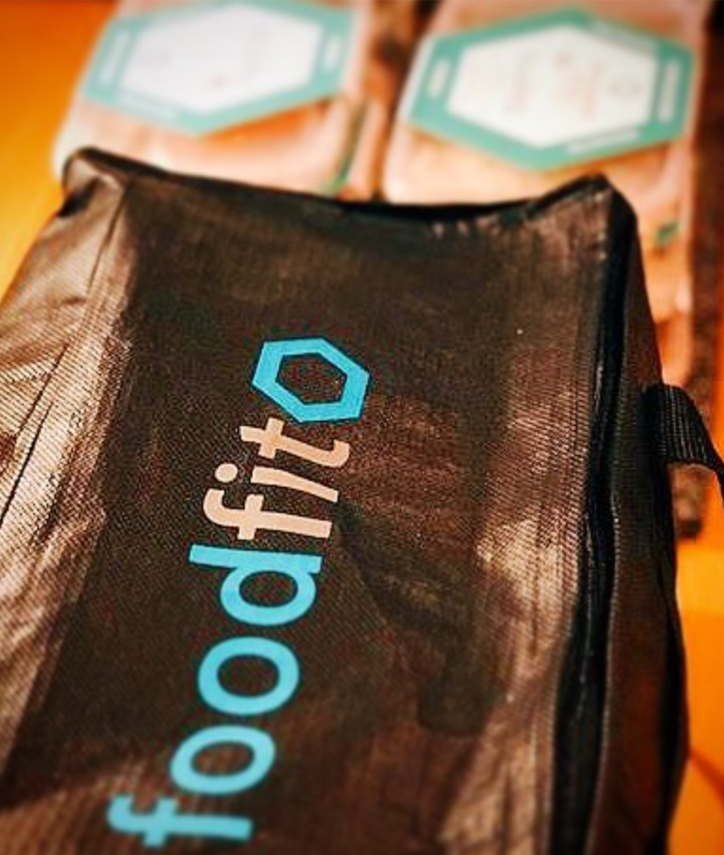 A Food Fit bag with Food Fit subscription boxes shows the staff and how they personalise your meals to achieve your goals.
