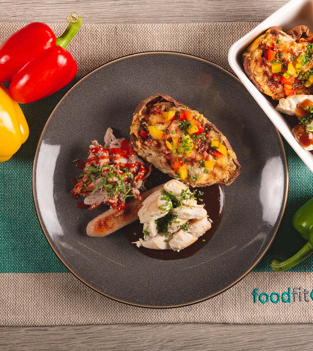 A personalised Food Fit meal on a grey plate shows what Food Fit is all about.