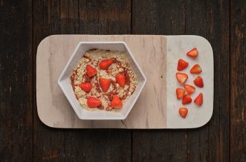 A low calorie Food Fit meal containing peanut butter and jelly in a white hexagonal bowl.