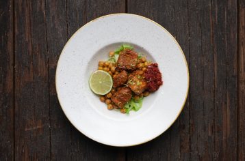 A high protein Food Fit meal containing chicken crushed harrisa in a white bowl.