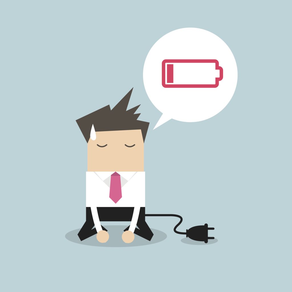 Businessman feeling tired, and a low battery graphic depicts the essentials of fatigue-fighting nutrients.